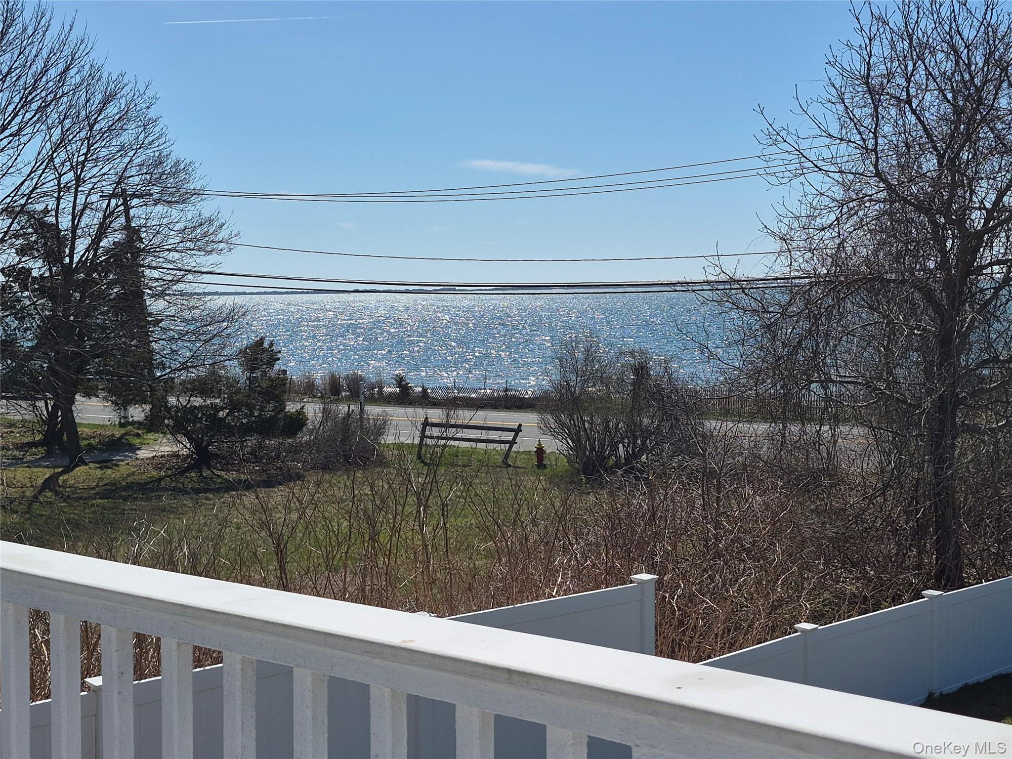 2 South Valley Road Hampton Bays, NY 11946 - Photo 15 of 19 a view of a lake from a balcony