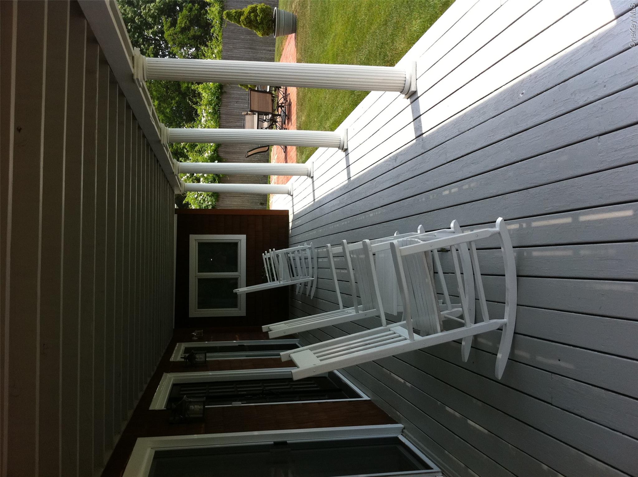 2 South Valley Road Hampton Bays, NY 11946 - Photo 18 of 19 a view of balcony with deck and outdoor seating
