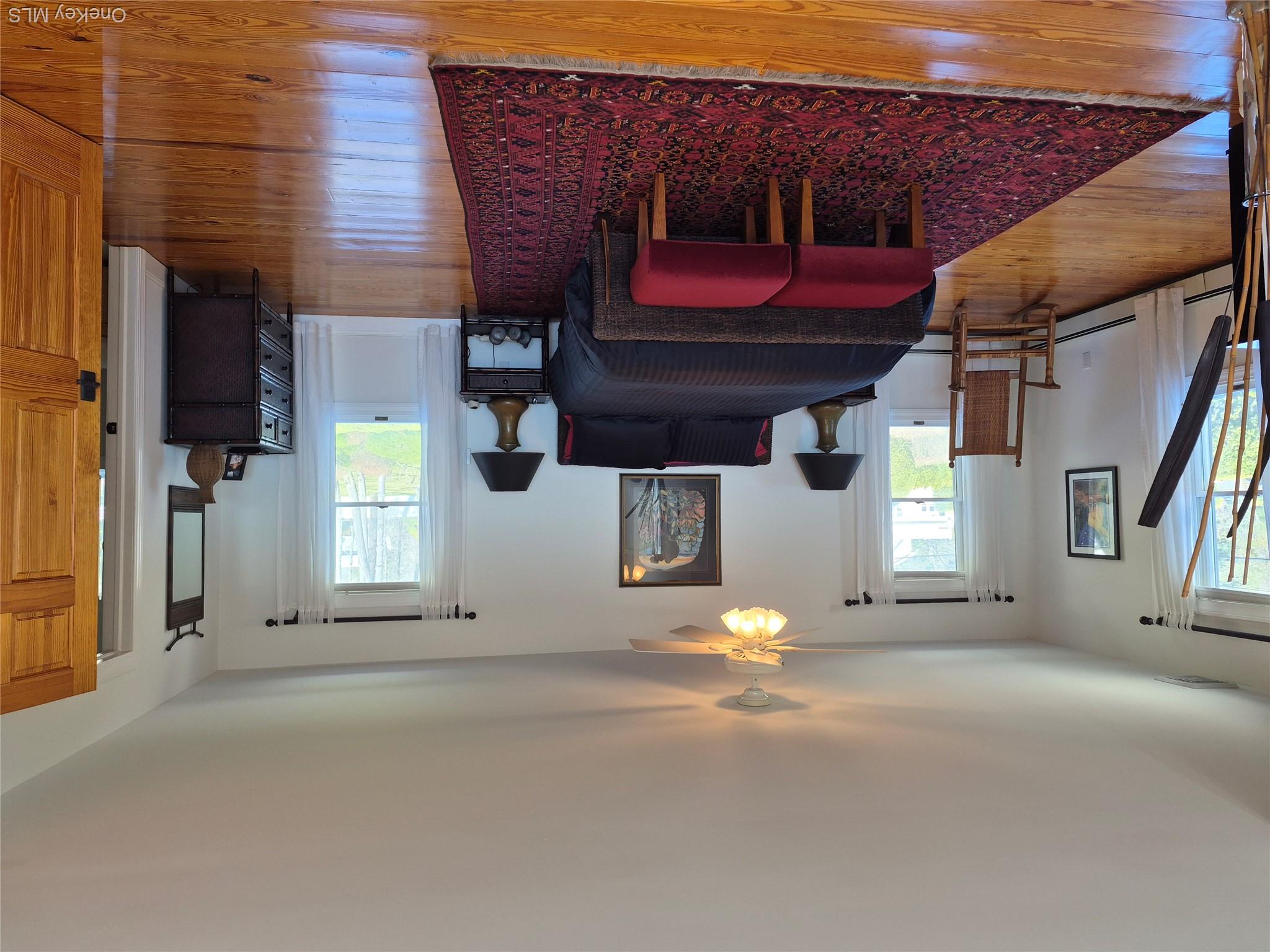 2 South Valley Road Hampton Bays, NY 11946 - Photo 10 of 19 a living room with furniture a window and a table