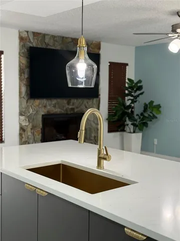 a kitchen with a sink and a stove