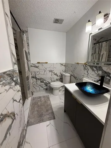 a view of kitchen and sink