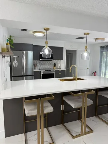 a kitchen with a table and chairs in it