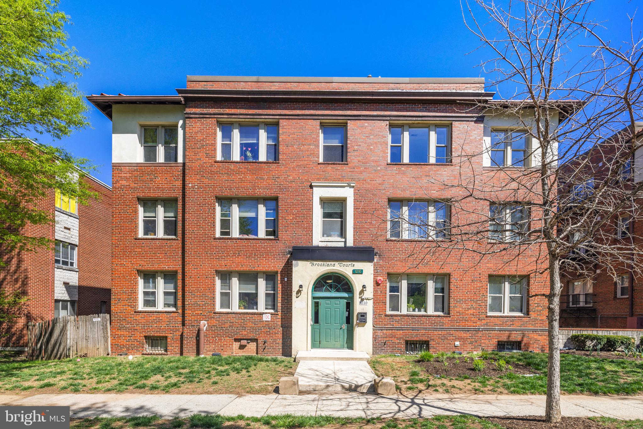 1210 Perry Street Northeast, Unit 201 Washington, DC 20017 - Photo 1 of 16 front view of a brick house