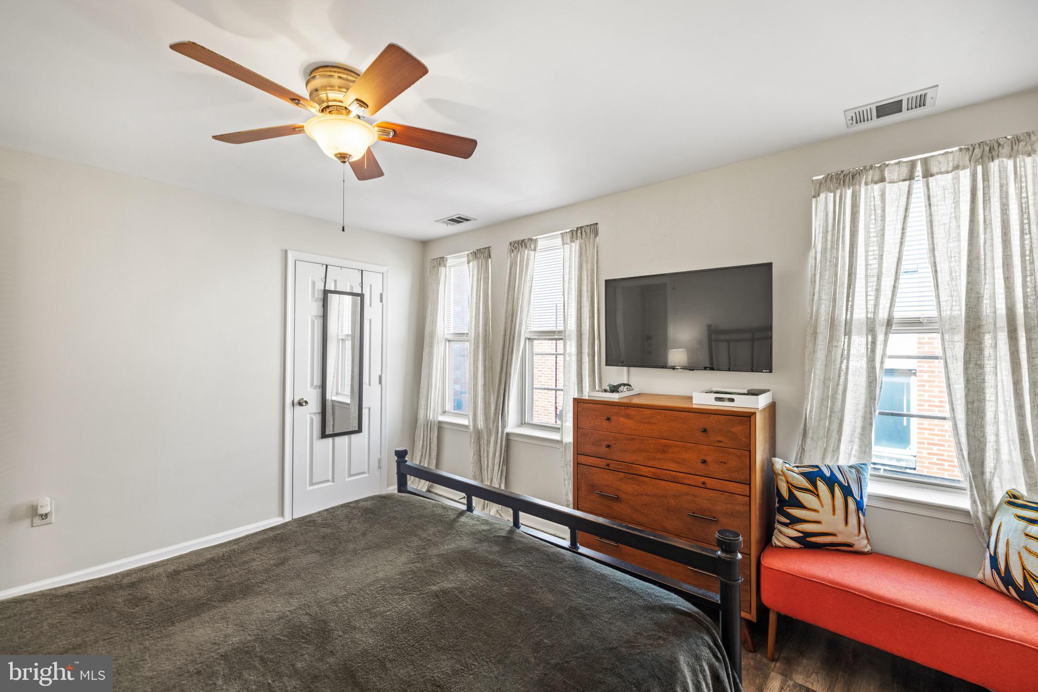 1210 Perry Street Northeast, Unit 201 Washington, DC 20017 - Photo 13 of 16 a living room with furniture and a flat screen tv