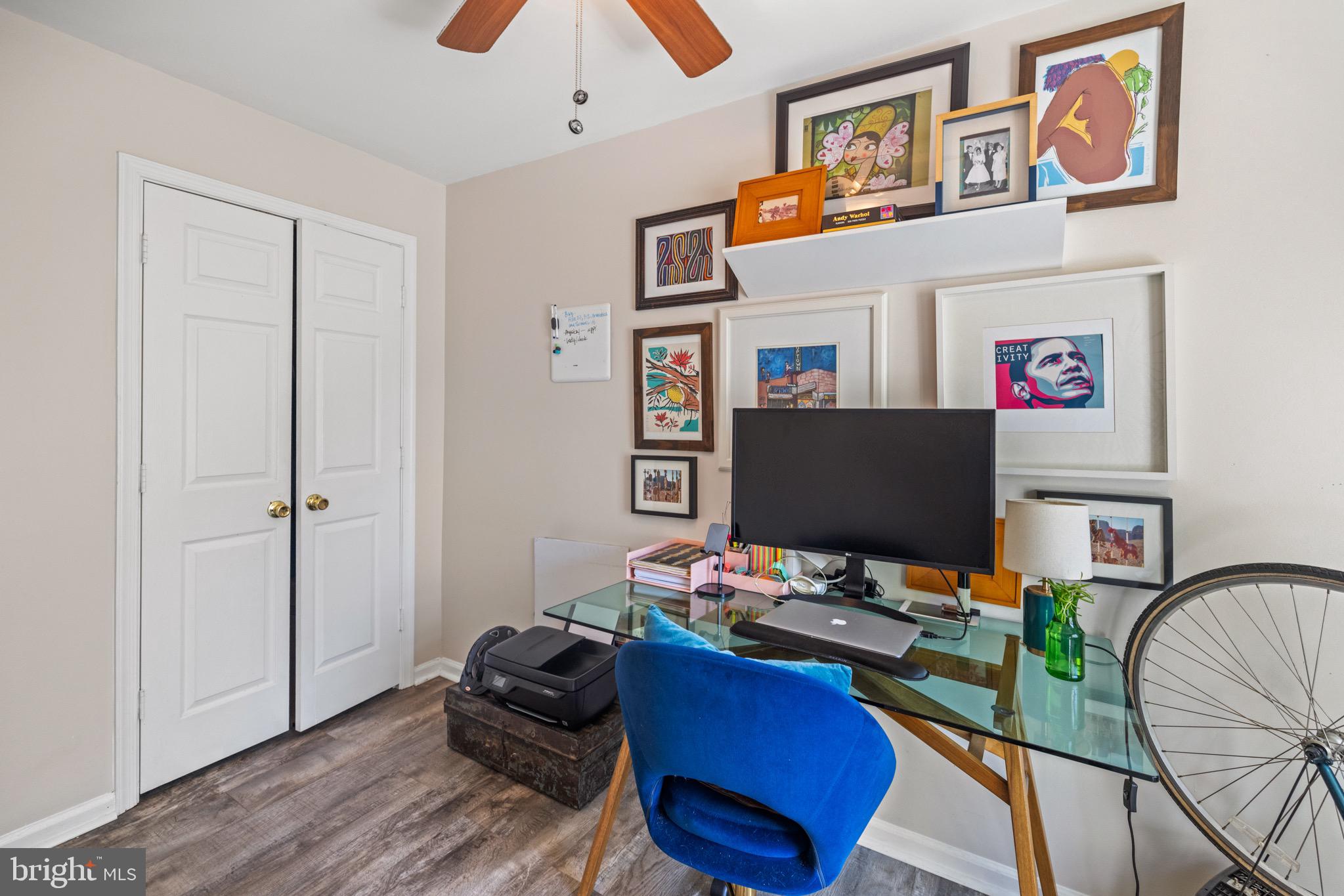 1210 Perry Street Northeast, Unit 201 Washington, DC 20017 - Photo 15 of 16 a workspace with furniture and wooden floor