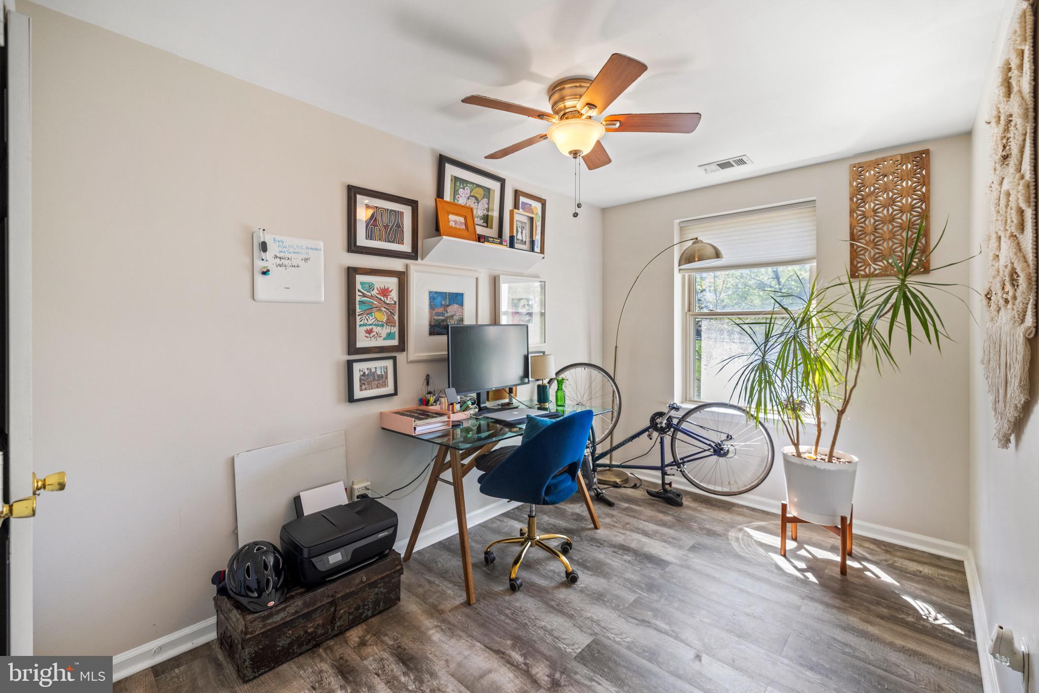 1210 Perry Street Northeast, Unit 201 Washington, DC 20017 - Photo 16 of 16 a work room with furniture and wooden floor