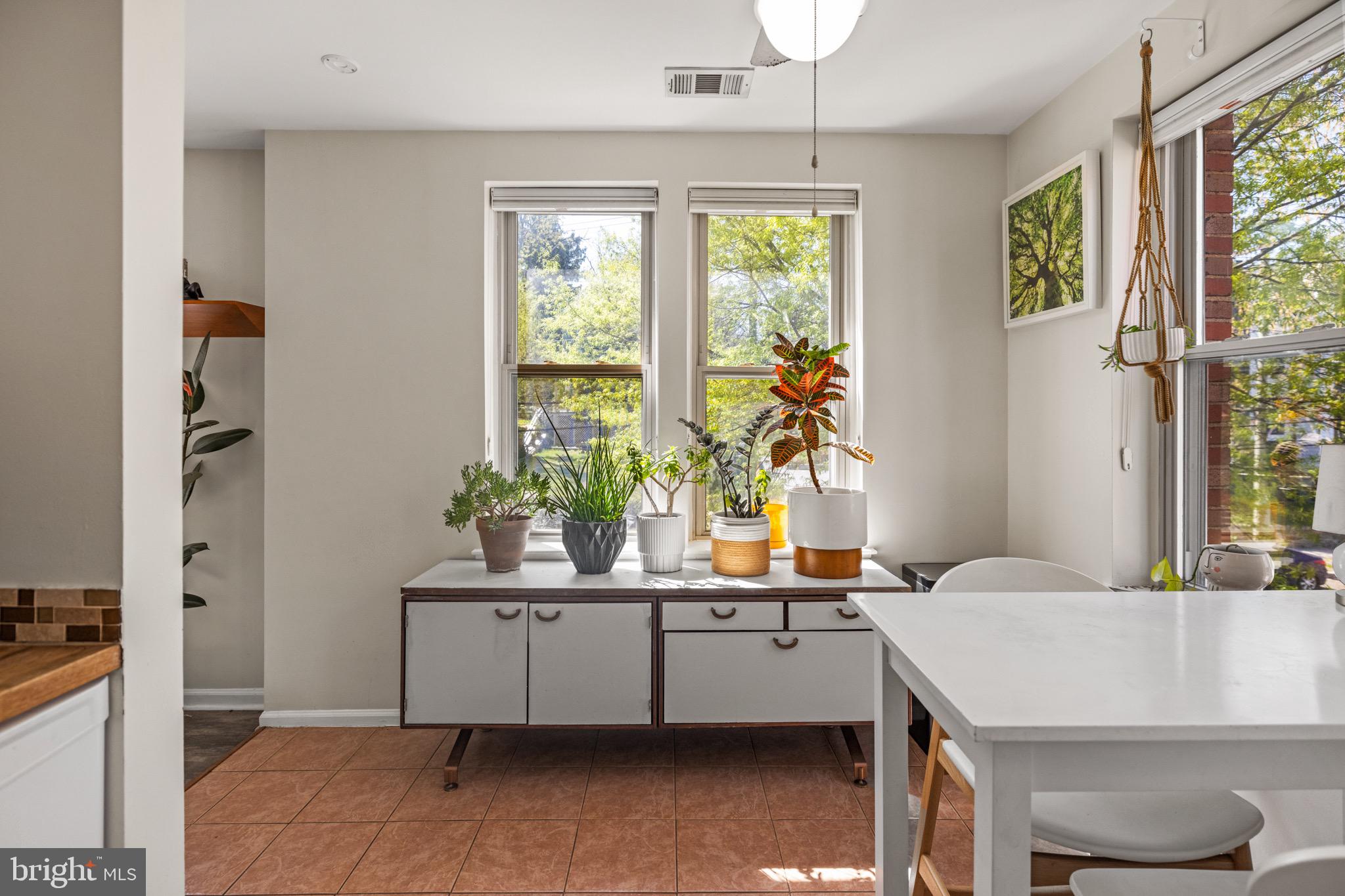 1210 Perry Street Northeast, Unit 201 Washington, DC 20017 - Photo 4 of 16 a room with a window and a table