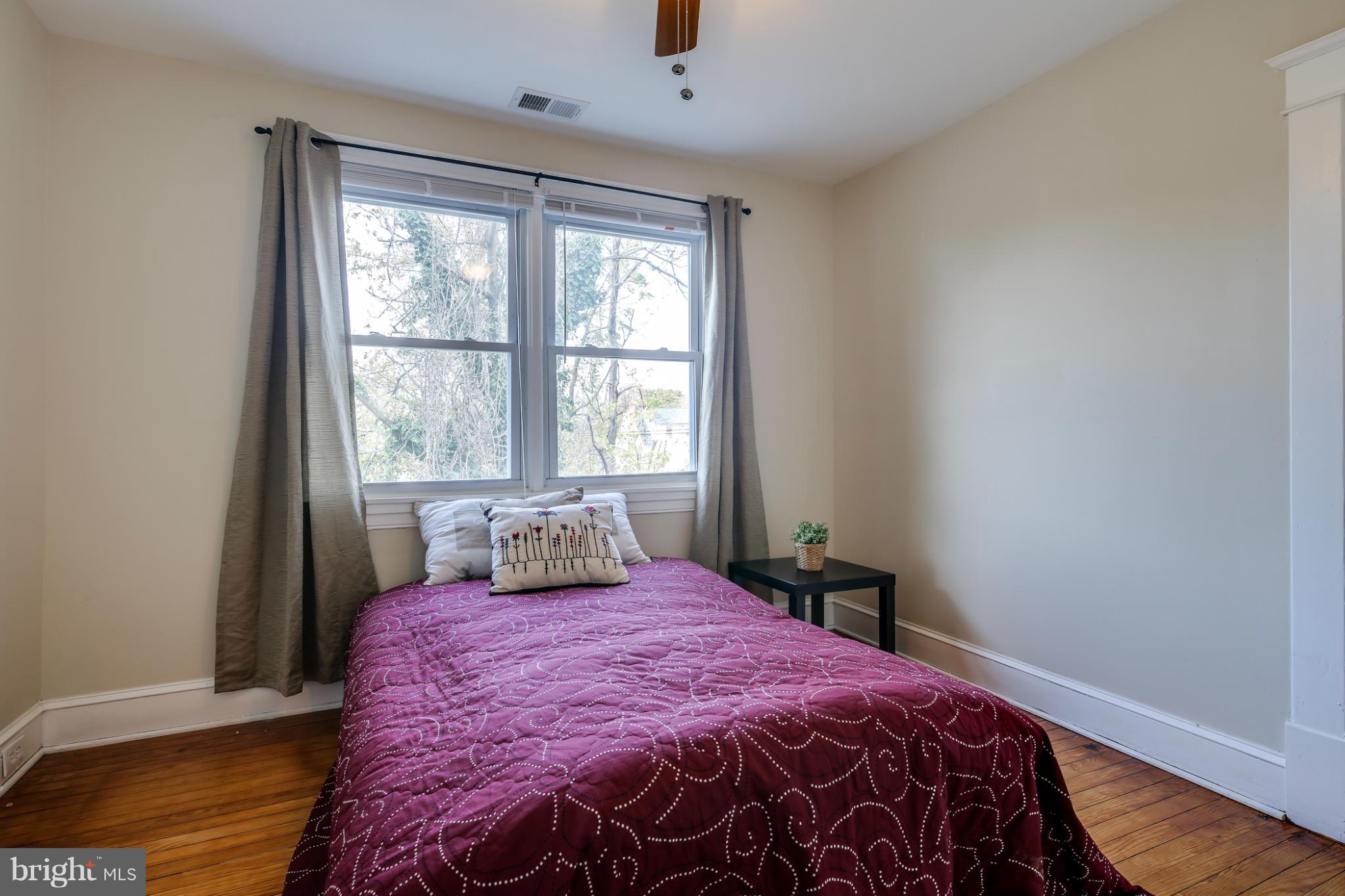 3202 Grace Road Baltimore, MD 21219 - Photo 20 of 29 a bedroom with a large bed and a window