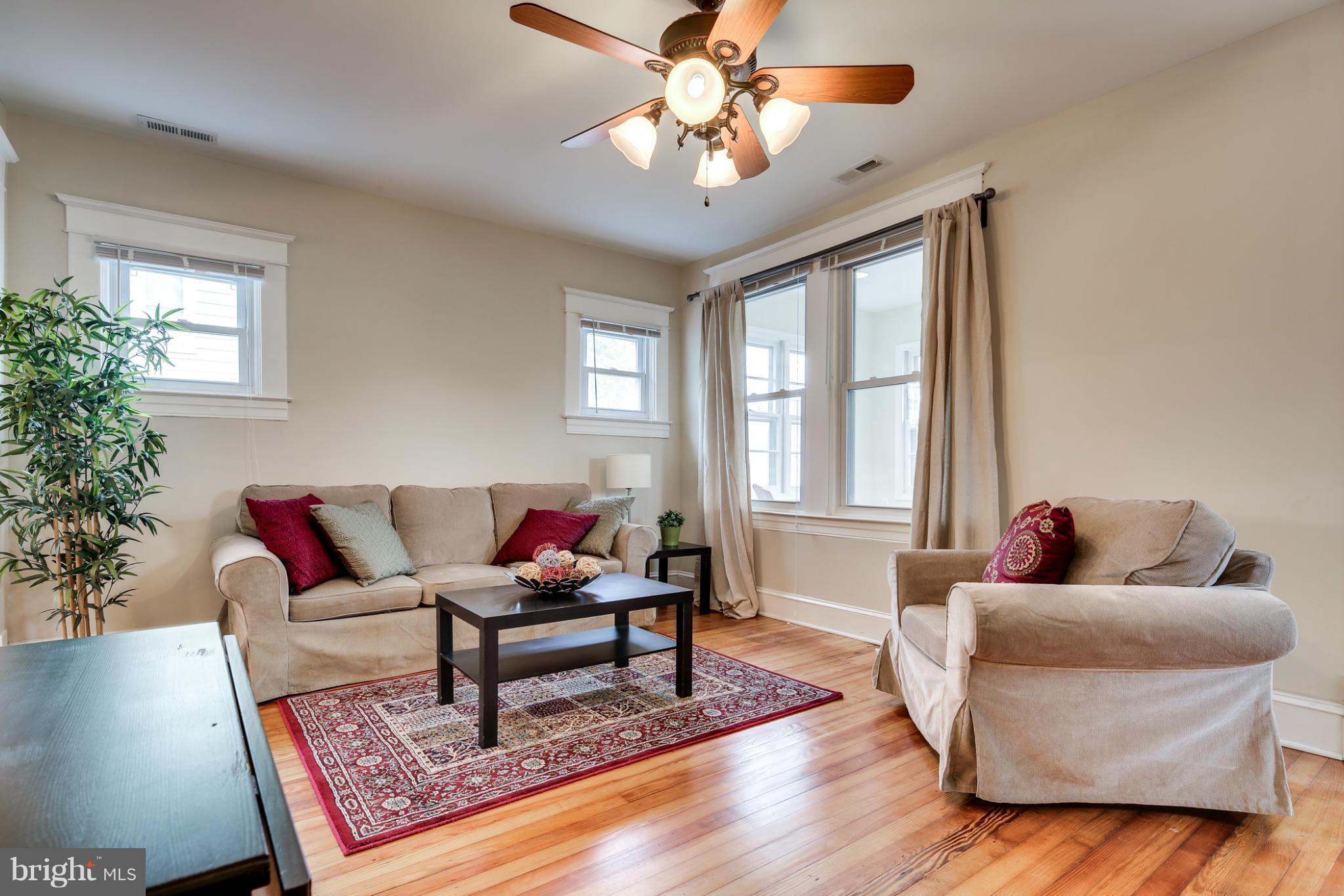 3202 Grace Road Baltimore, MD 21219 - Photo 3 of 29 a living room with furniture and a potted plant