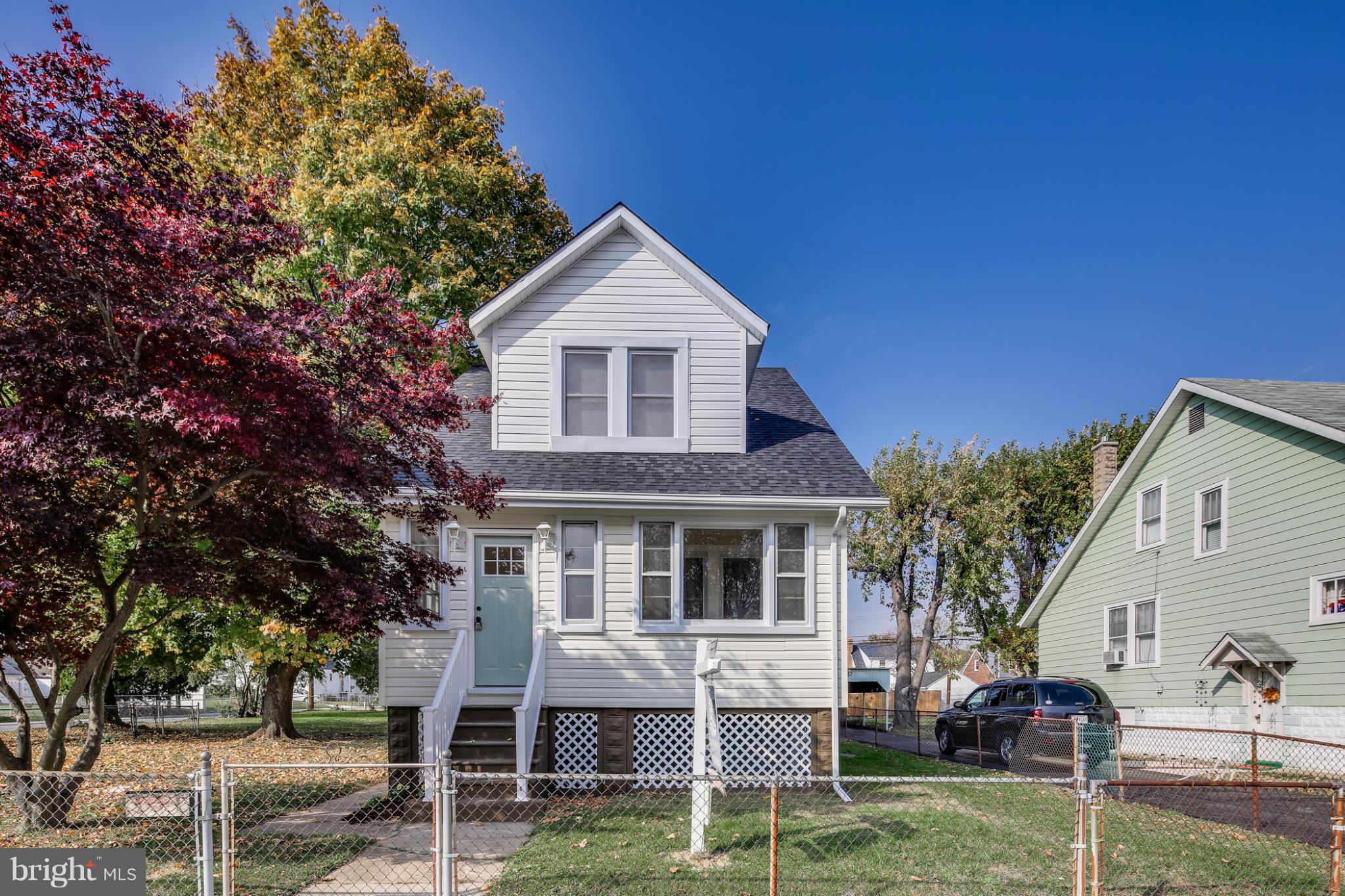 3202 Grace Road Baltimore, MD 21219 - Photo 28 of 29 a front view of a house with a yard