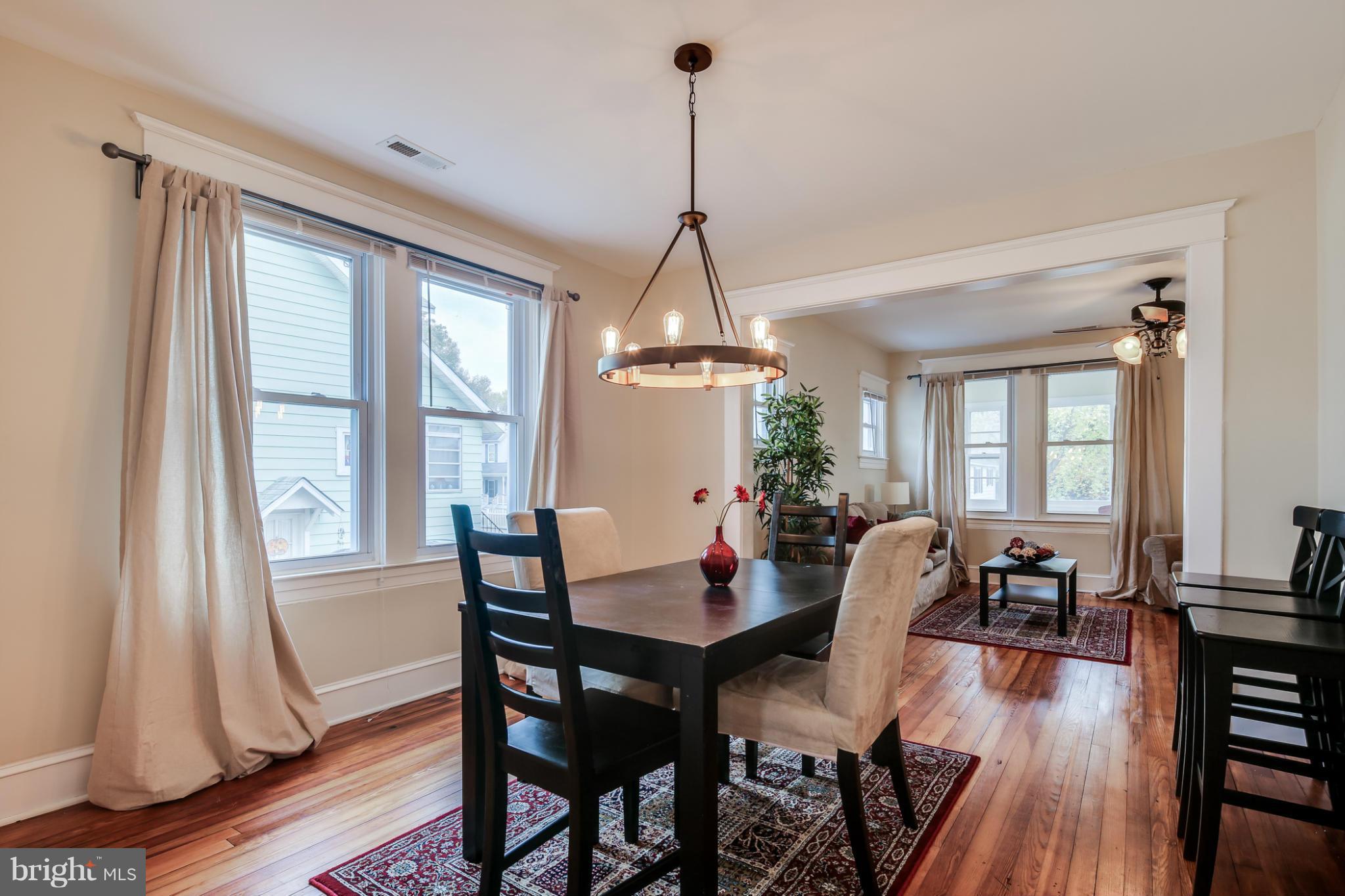 3202 Grace Road Baltimore, MD 21219 - Photo 4 of 29 a view of a dining room with furniture window and wooden floor