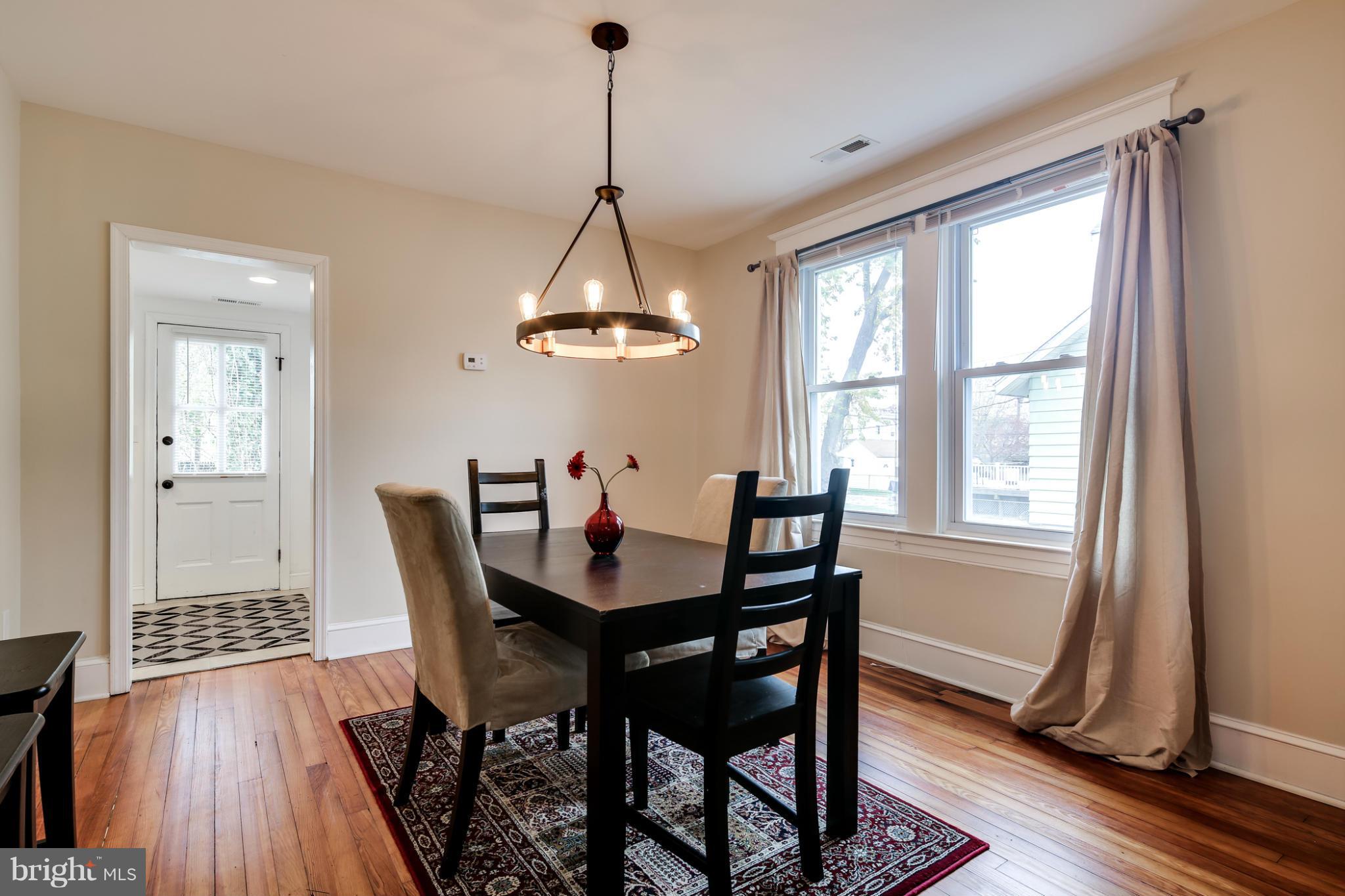 3202 Grace Road Baltimore, MD 21219 - Photo 5 of 29 a view of a dining room with furniture window and wooden floor