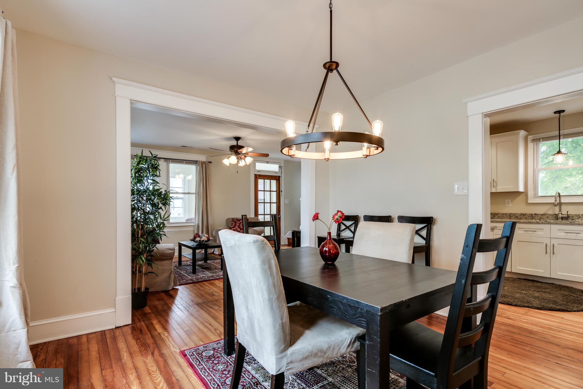 3202 Grace Road Baltimore, MD 21219 - Photo 6 of 29 a view of a dining room with furniture window and wooden floor