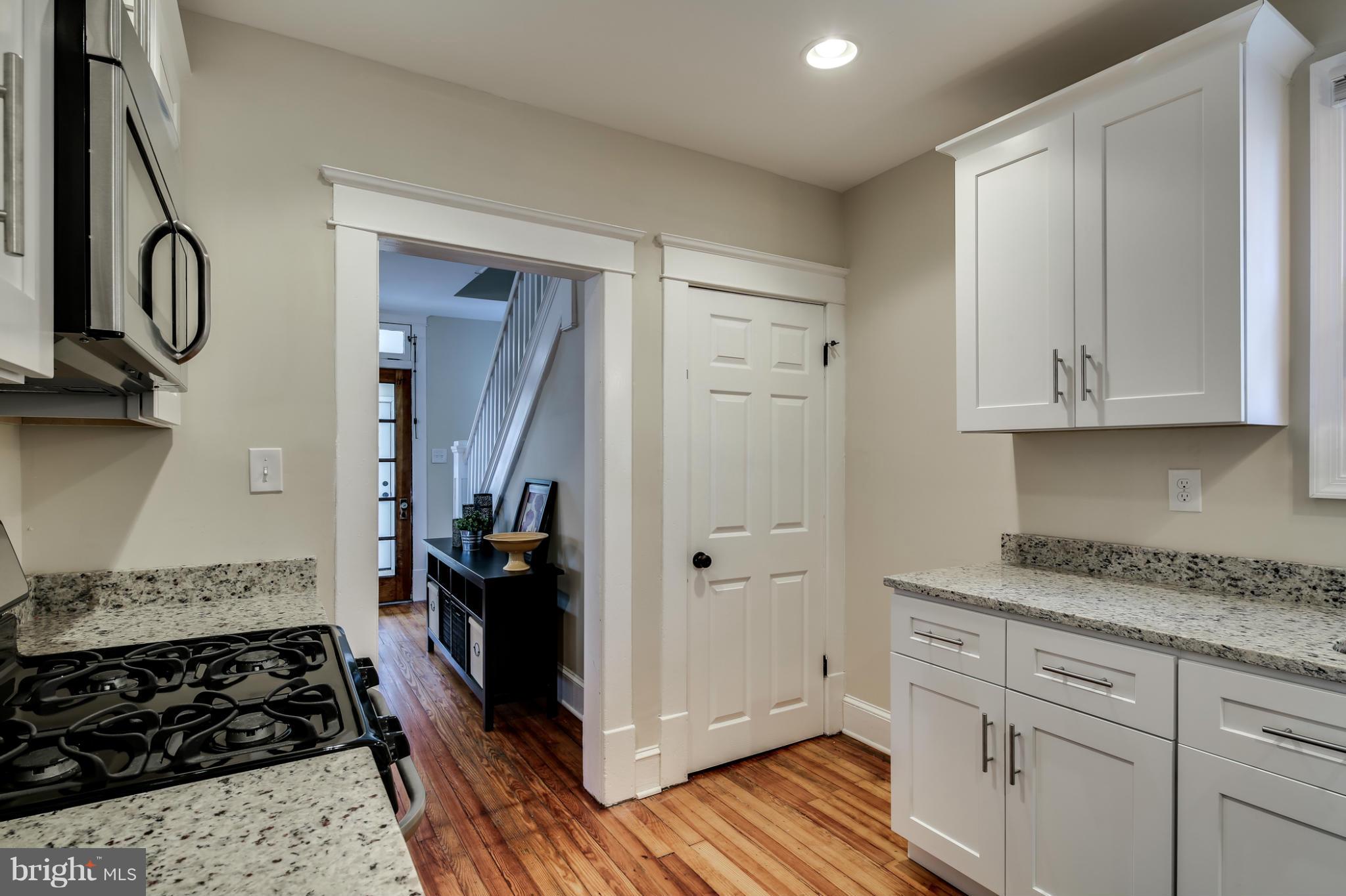 3202 Grace Road Baltimore, MD 21219 - Photo 9 of 29 a kitchen with stainless steel appliances granite countertop a stove and a refrigerator