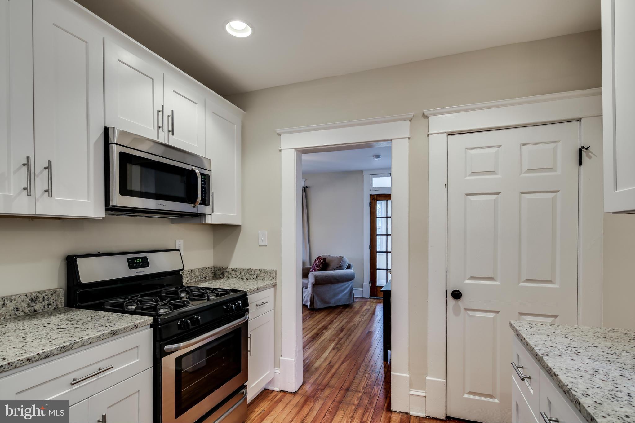 3202 Grace Road Baltimore, MD 21219 - Photo 10 of 29 a kitchen with granite countertop a stove and a sink