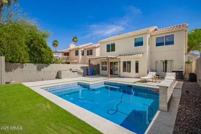 a front view of a house with swimming pool