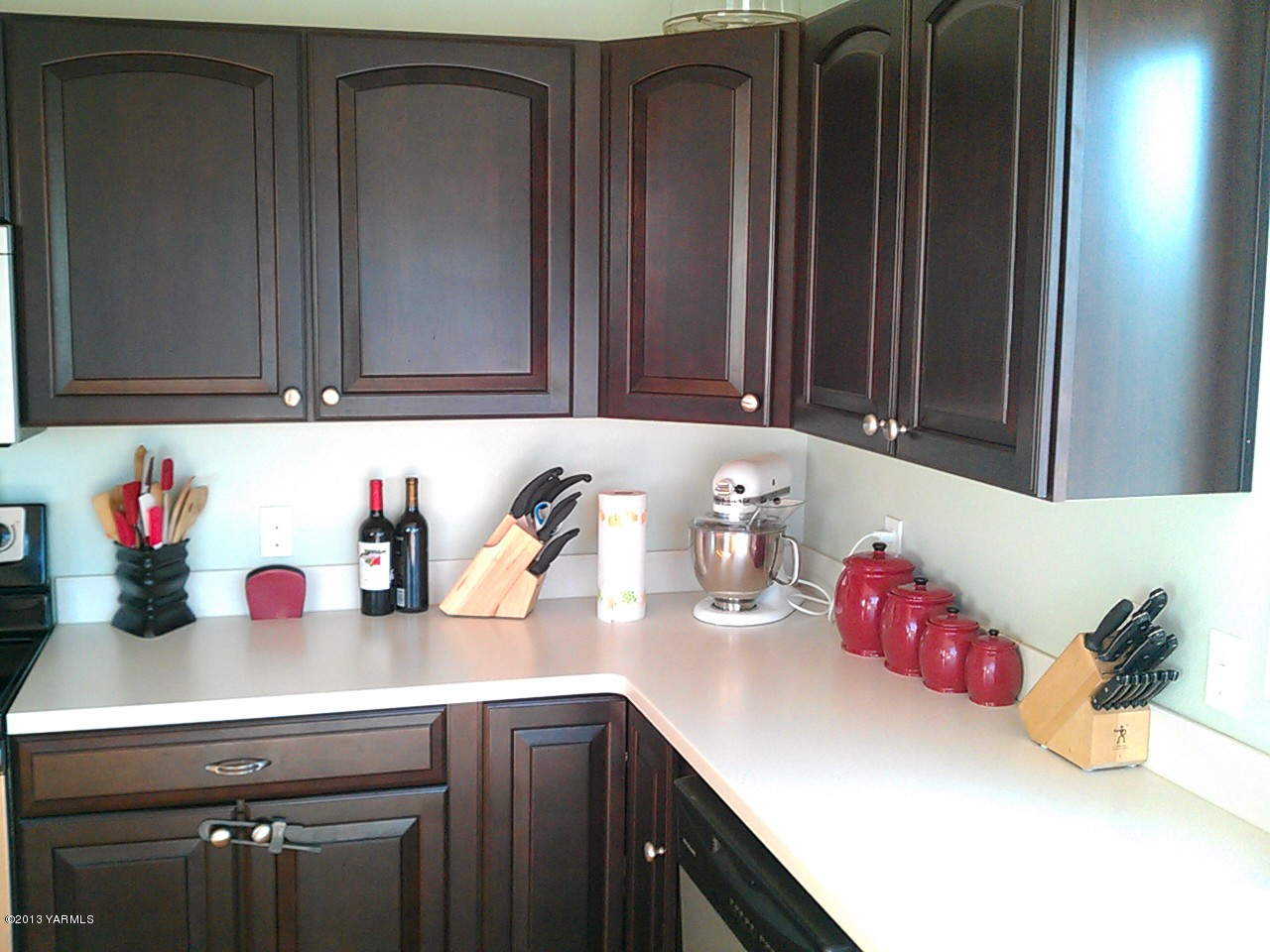7305 Mieras Road Yakima, WA 98901 - Photo 14 of 15 a kitchen with a sink cabinets and utility room