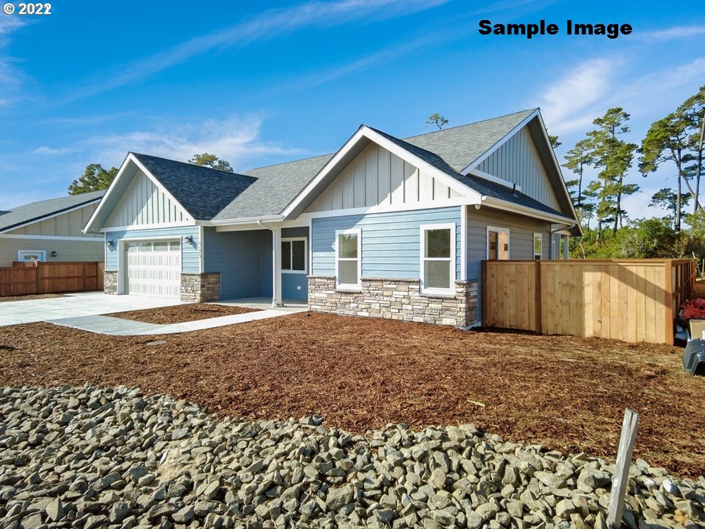 1800 Dunbar Way Florence, OR 97439 - Photo 1 of 32 a view of a house with a yard