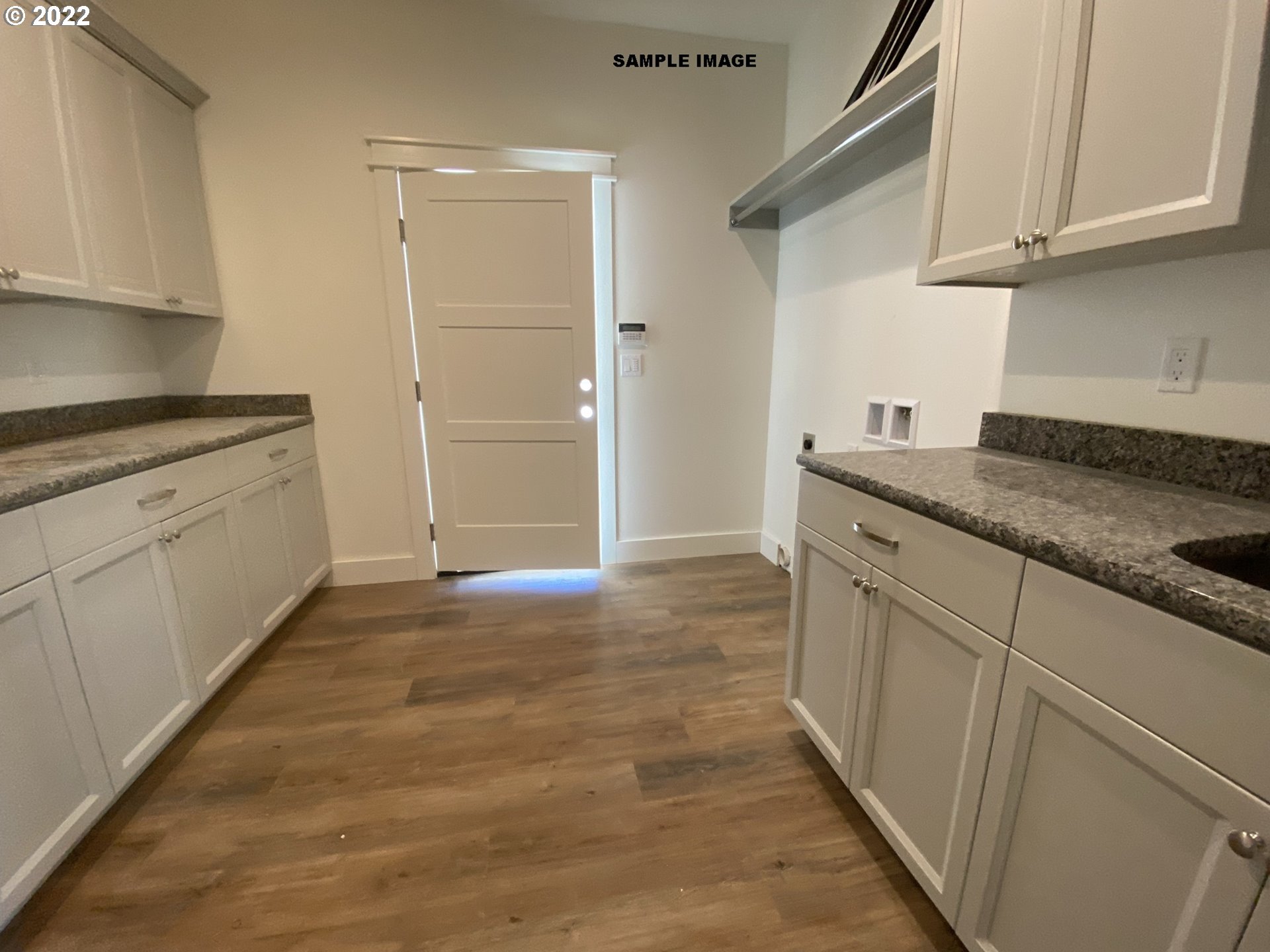 1800 Dunbar Way Florence, OR 97439 - Photo 13 of 32 a kitchen with granite countertop a sink and cabinets