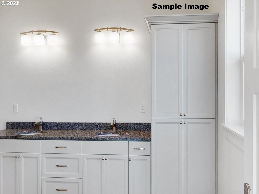 1800 Dunbar Way Florence, OR 97439 - Photo 27 of 32 a bathroom with a granite countertop sink and vanity