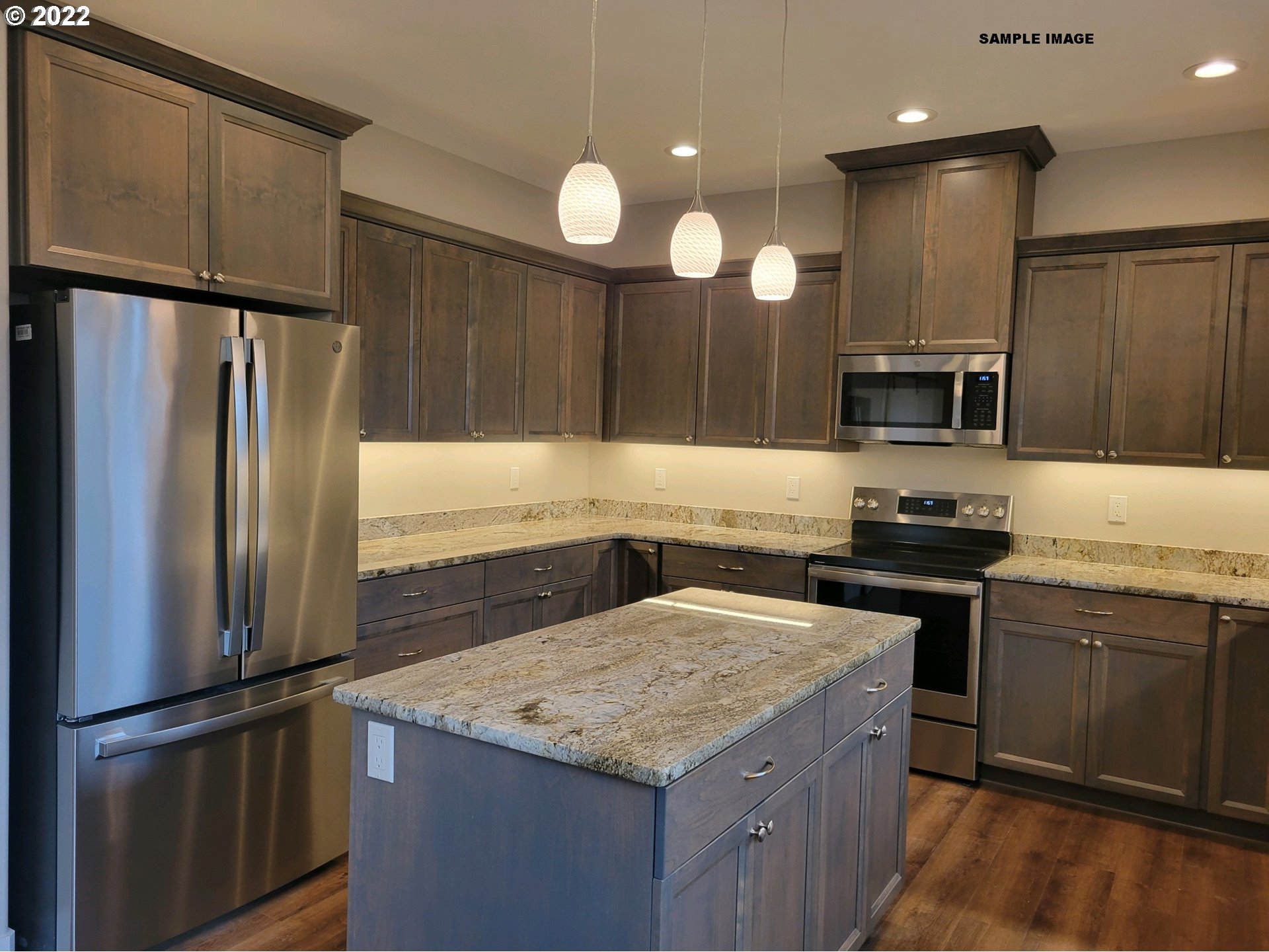 1800 Dunbar Way Florence, OR 97439 - Photo 5 of 32 a kitchen with a refrigerator and a sink