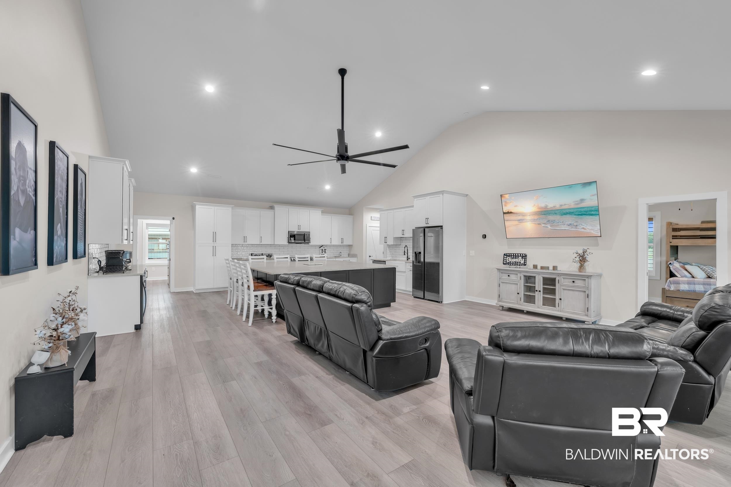 22592 Pastoral Lane Foley, AL 36535 - Photo 9 of 45 Living area with healthy amount of natural light, ceiling fan, high vaulted ceiling, light wood-type flooring, and recessed lighting