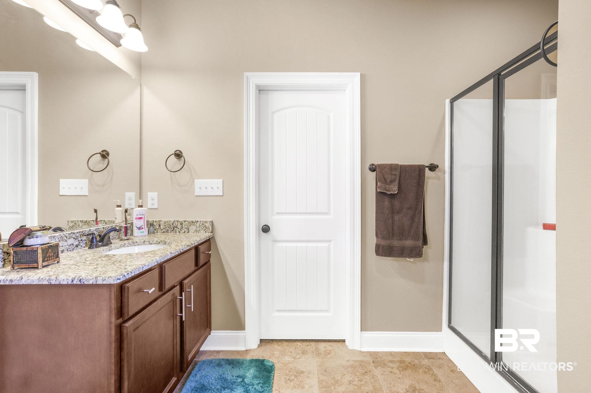 1090 Destin Avenue Foley, AL 36535 - Photo 13 of 30 Full bathroom with a stall shower, vanity, and baseboards
