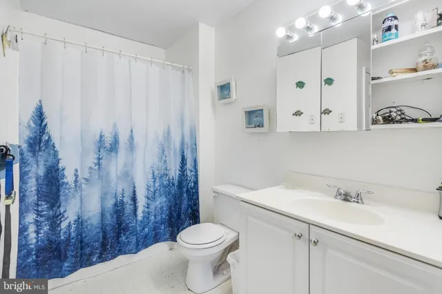 a view of a room with furniture and a window