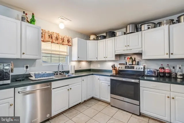 a dining room with a table and chairs