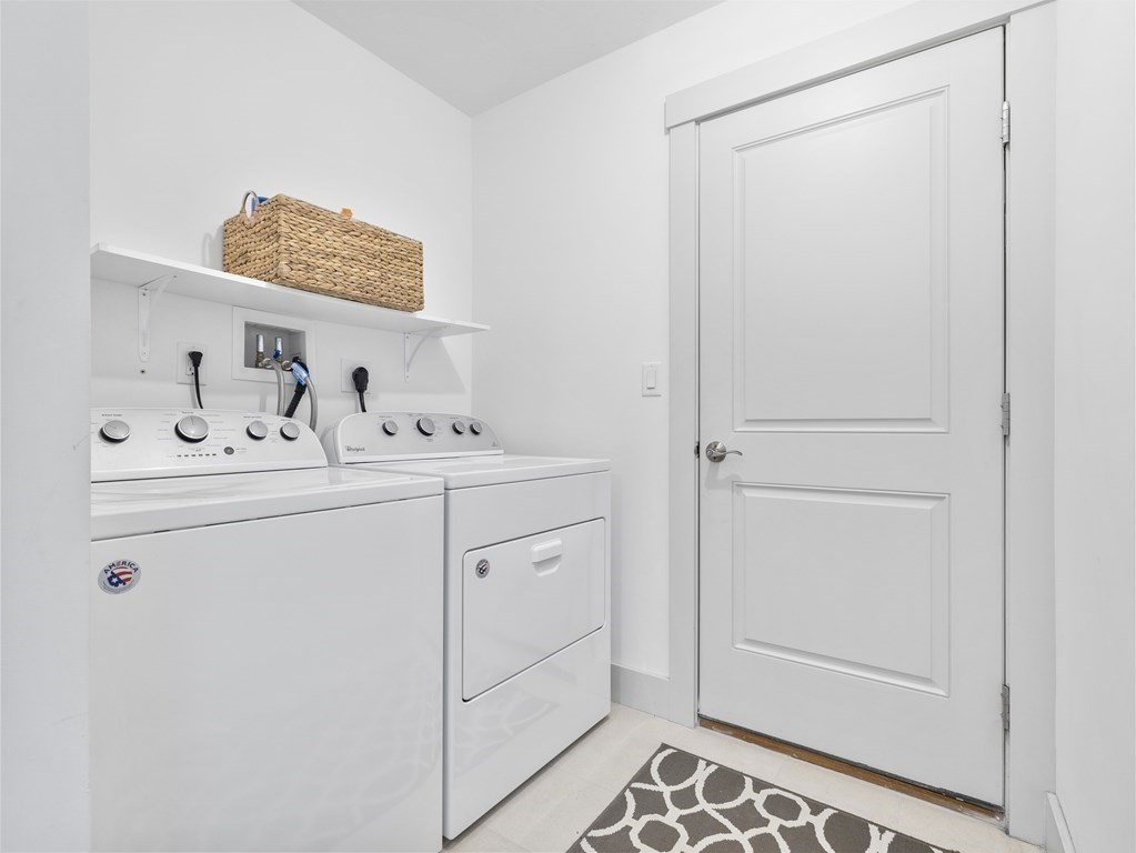 34 Lantern Way, Unit 34 Ashland, MA 01721 - Photo 17 of 30 a utility room with cabinets washer and dryer