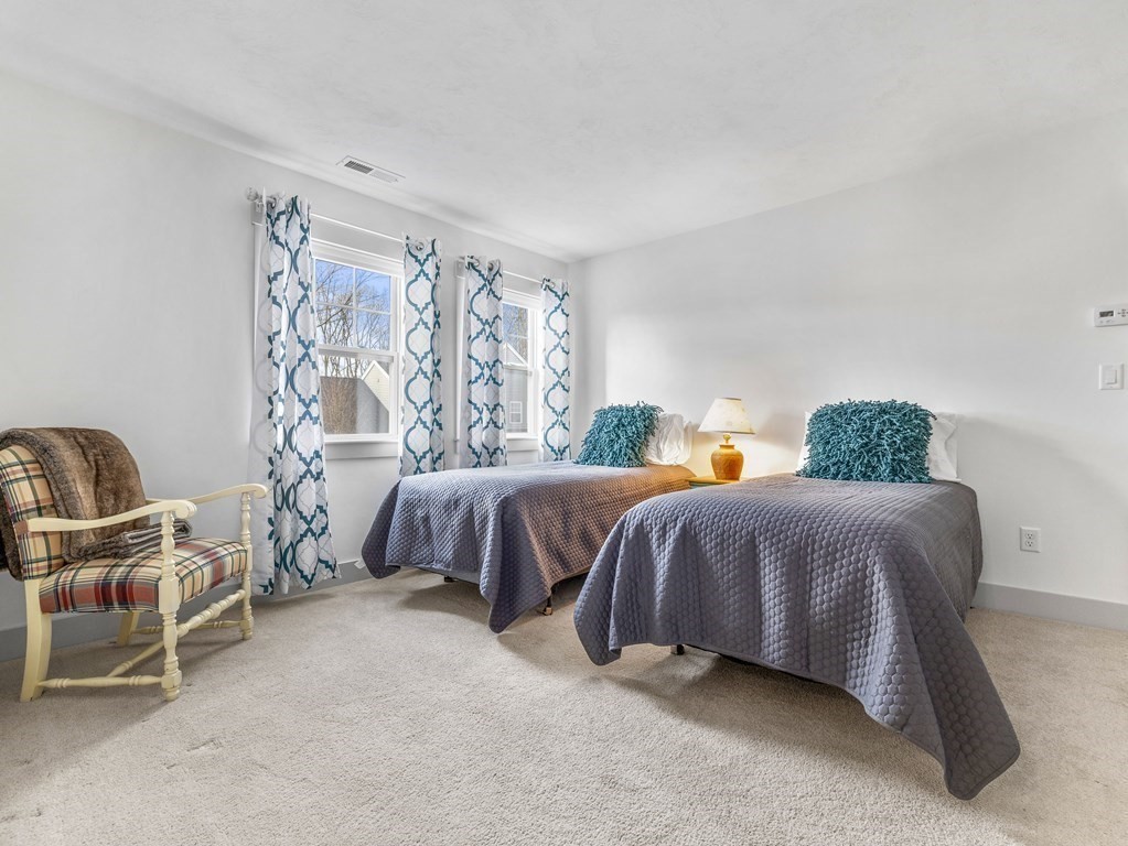 34 Lantern Way, Unit 34 Ashland, MA 01721 - Photo 21 of 30 a bedroom with a bed and a window
