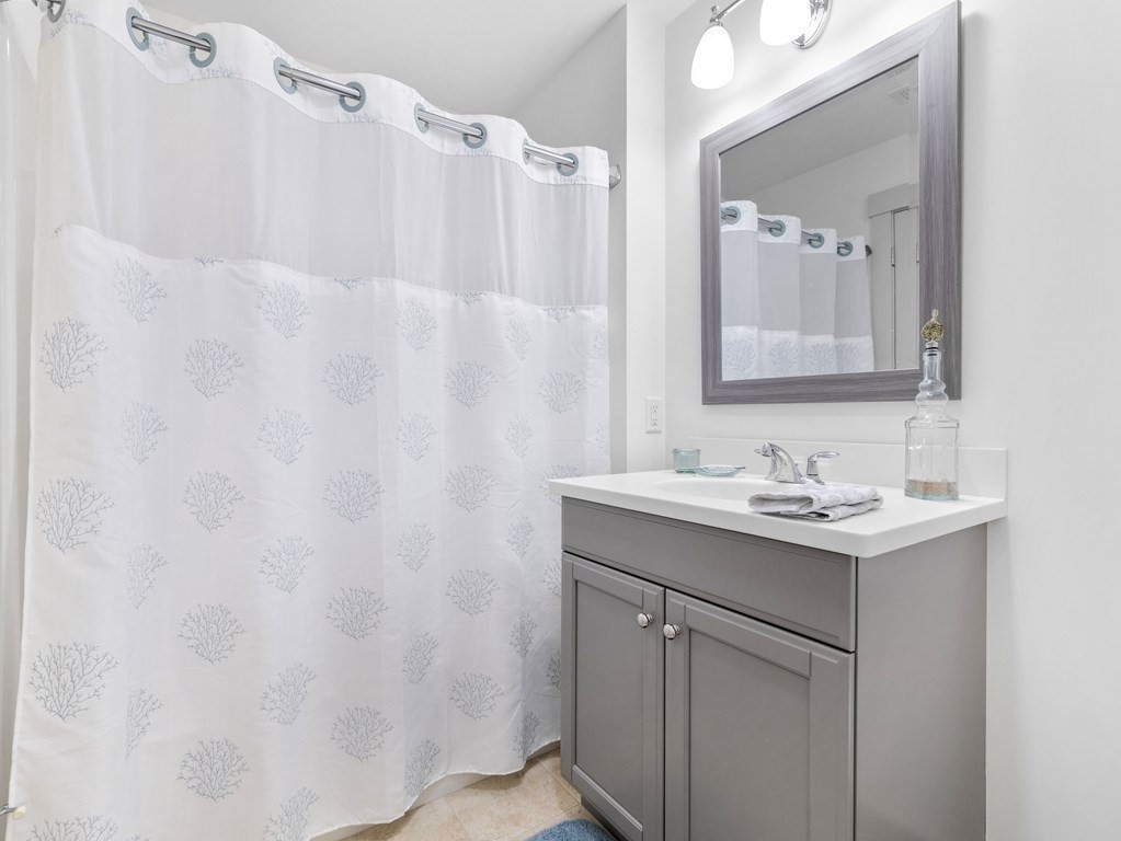 34 Lantern Way, Unit 34 Ashland, MA 01721 - Photo 23 of 30 a bathroom with a sink and a mirror