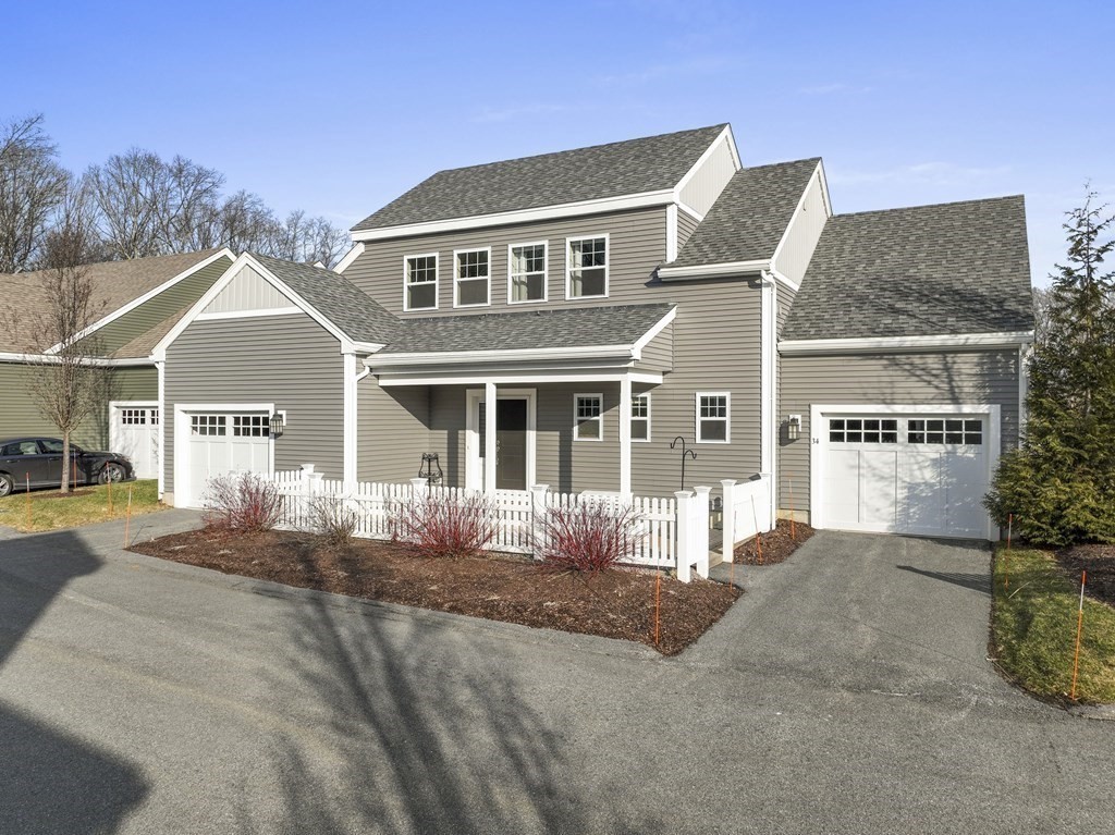 34 Lantern Way, Unit 34 Ashland, MA 01721 - Photo 30 of 30 a front view of a house with a yard
