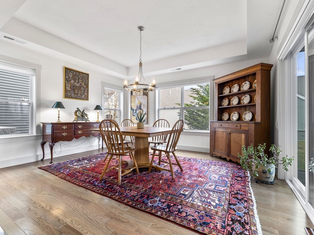 34 Lantern Way, Unit 34 Ashland, MA 01721 - Photo 6 of 30 a view of a dining room with furniture window and wooden floor