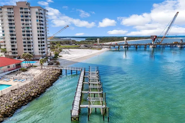 a view of swimming pool with outdoor seating space
