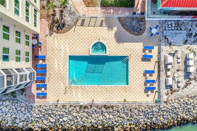a bed sitting in a bedroom next to a wooden floor