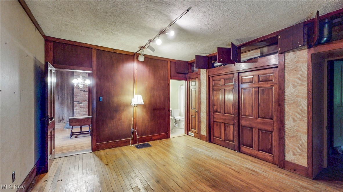1811 Randolph Road Mogadore, OH 44260 - Photo 6 of 17 Living Room / 1st floor BR w/access to full bath, wall of closets & storage w/access to Dining Room, Stairway to 2nd level, Family Room & Mudroom
