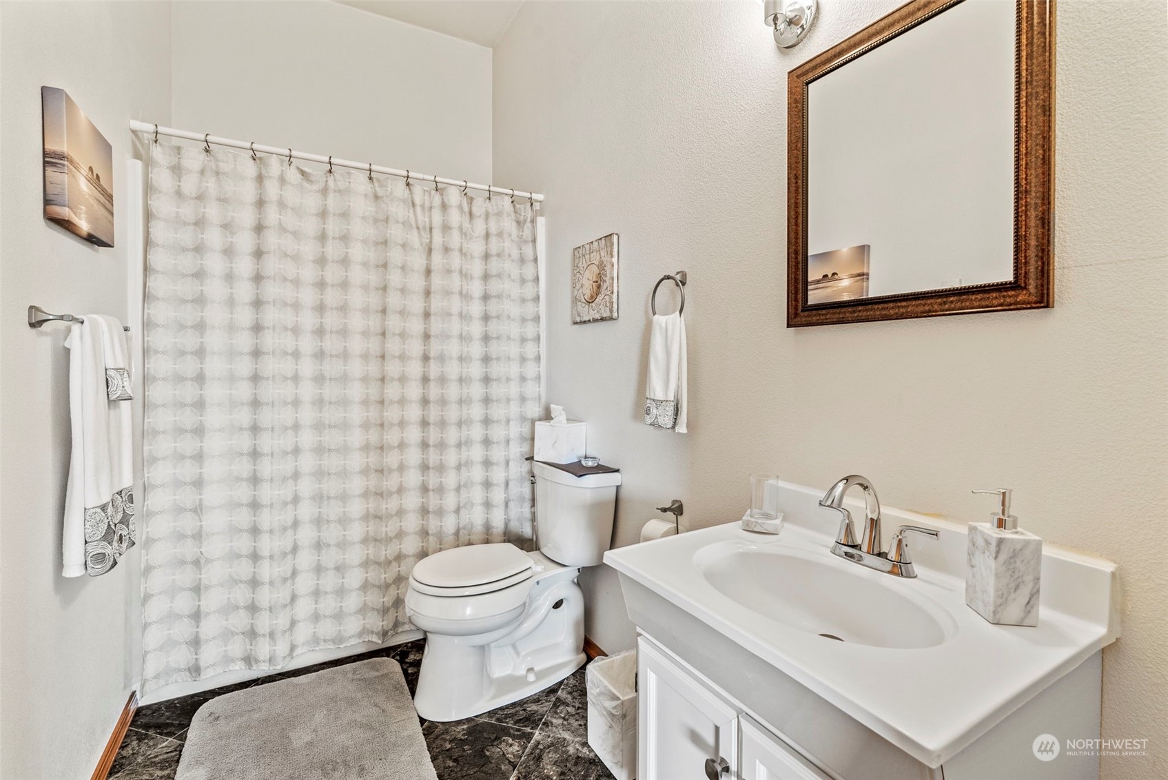 198 Whitewater Road Longview, WA 98632 - Photo 24 of 34 a bathroom with a sink a toilet and shower curtain