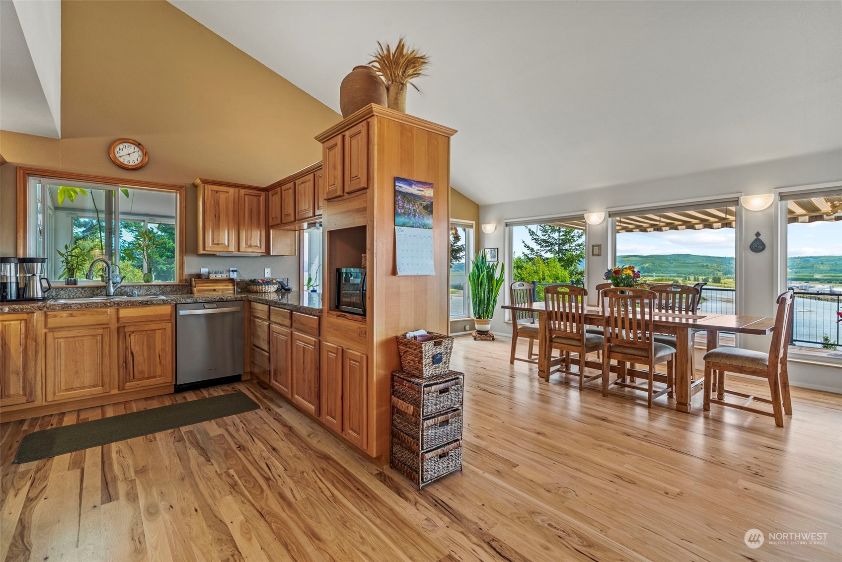 198 Whitewater Road Longview, WA 98632 - Photo 8 of 34 a kitchen with stainless steel appliances wooden floors and wooden cabinets