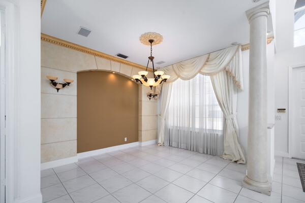 576 Northwest 120th Drive Coral Springs, FL 33071 - Photo 14 of 23 a view of a chandelier fan and entryway
