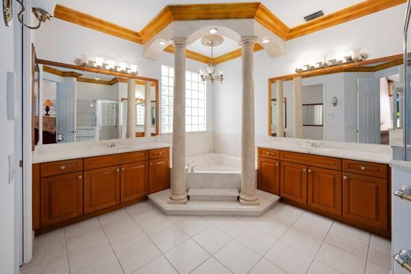576 Northwest 120th Drive Coral Springs, FL 33071 - Photo 19 of 23 a spacious bathroom with a granite countertop sink mirror and bathtub
