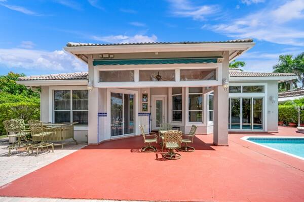 576 Northwest 120th Drive Coral Springs, FL 33071 - Photo 5 of 23 a view of a house with table and chairs in patio