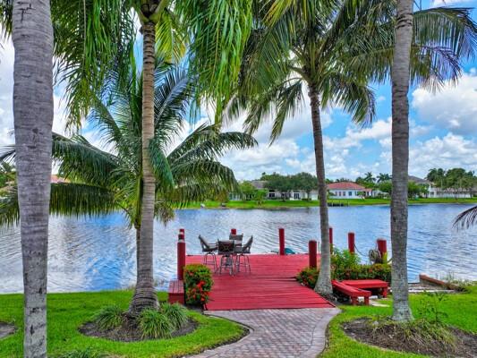 576 Northwest 120th Drive Coral Springs, FL 33071 - Photo 7 of 23 a garden view with a lake view