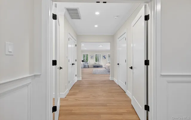 a view of a hallway with white walls