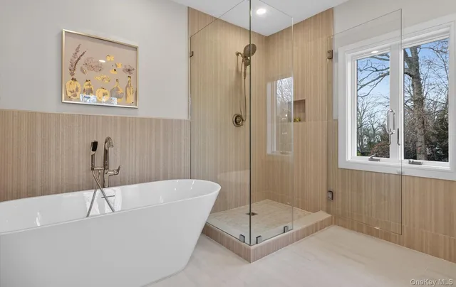 a bathroom with a bathtub and a shower