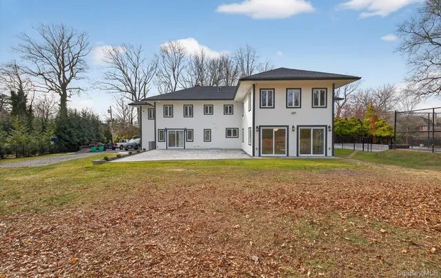 a swimming pool view with a outdoor seating