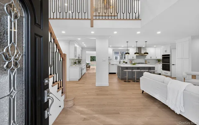 a kitchen with stainless steel appliances kitchen island a refrigerator and a stove top oven