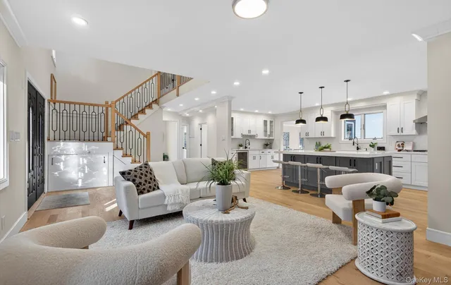 a living room with furniture and white walls