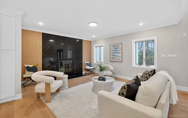 a living room with furniture and a large mirror