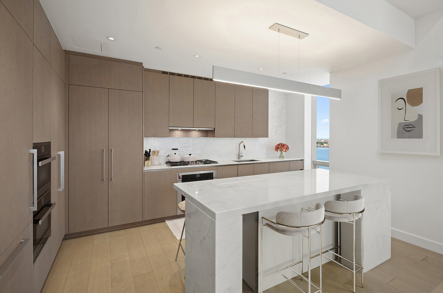 15 Hudson Yards, Unit 33H Manhattan, NY 10001 - Photo 3 of 10 a kitchen with stainless steel appliances a stove a refrigerator and a refrigerator with wooden floor